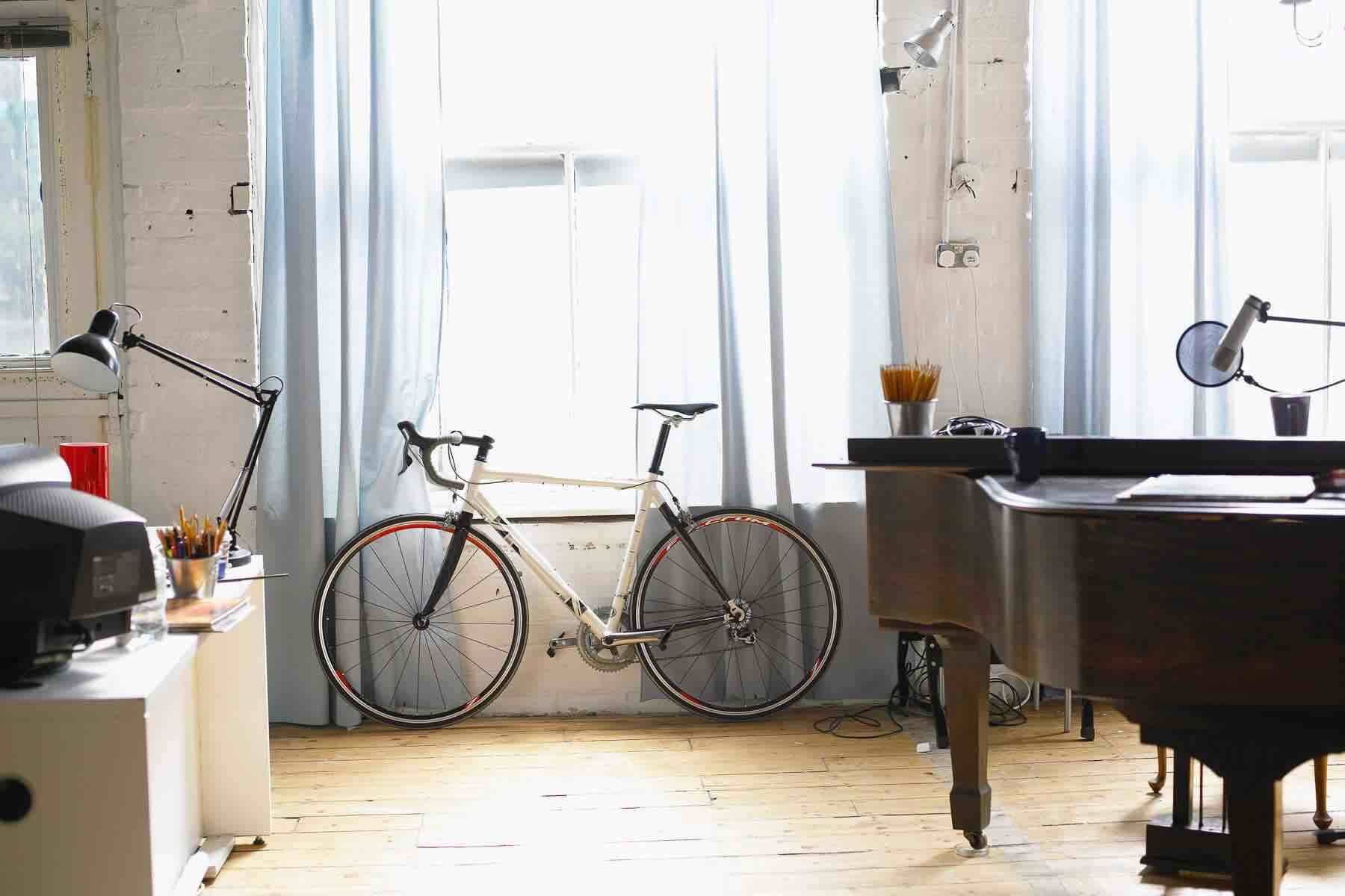 Bicycle stands besides window
